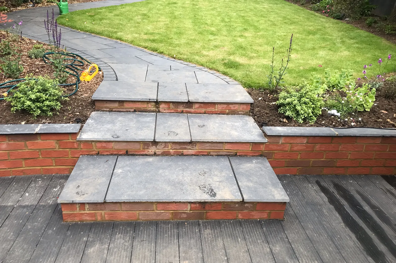 Brick-faced steps and retaining wall on a slate path, Farnham Royal, Slough, 2021