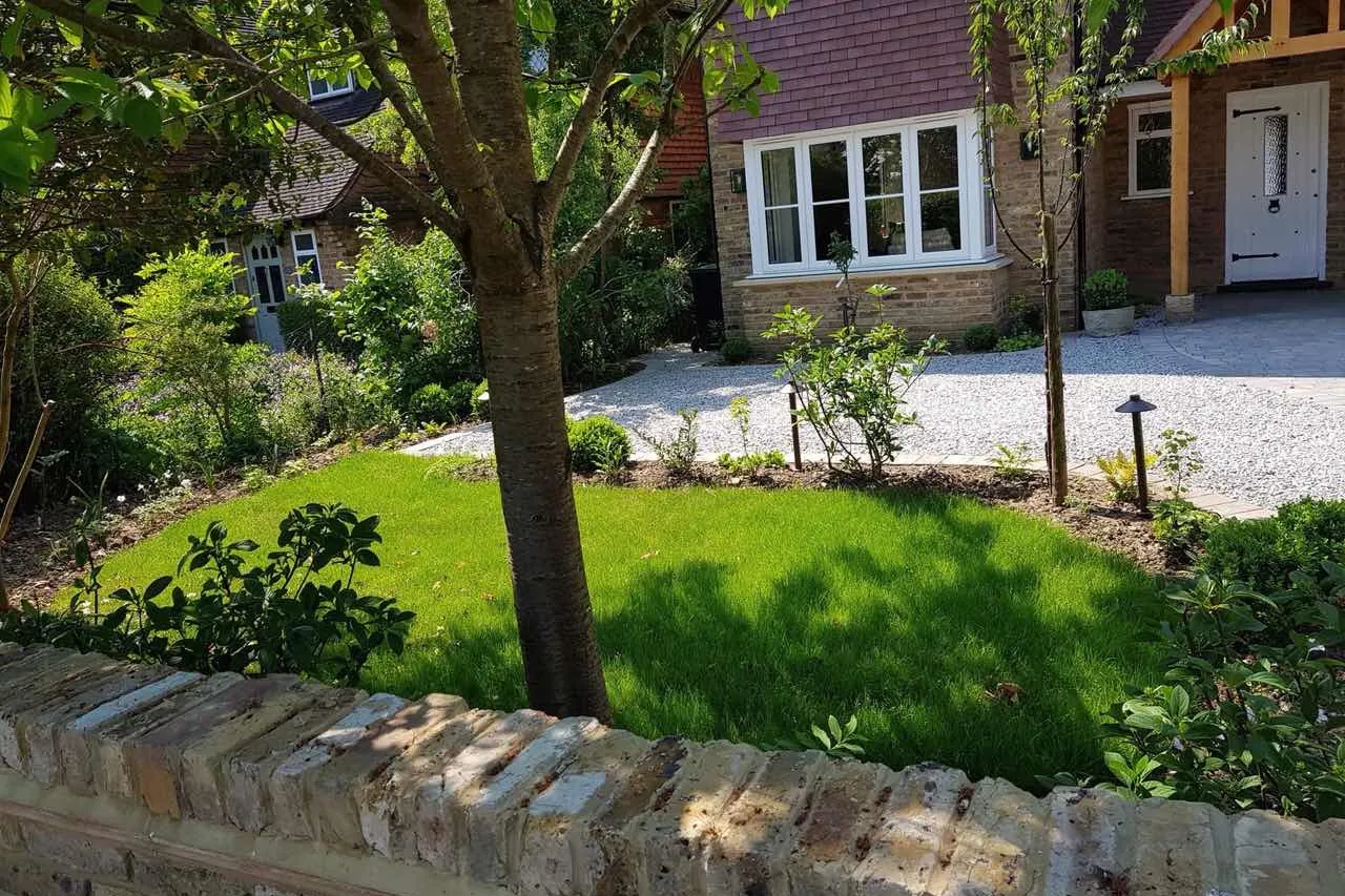 Brick front wall with a coping course, a new lawn behind, Farnham Royal, Slough, 2018