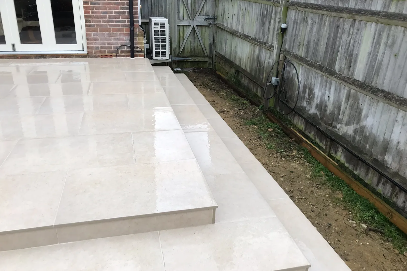 Porcelain steps down from the raised patio to the garden, Marlow, 2021