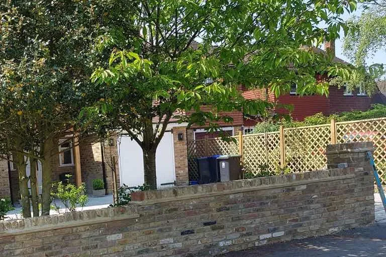 Trellis fencing above a new front wall, Farnham Royal, Slough, 2018