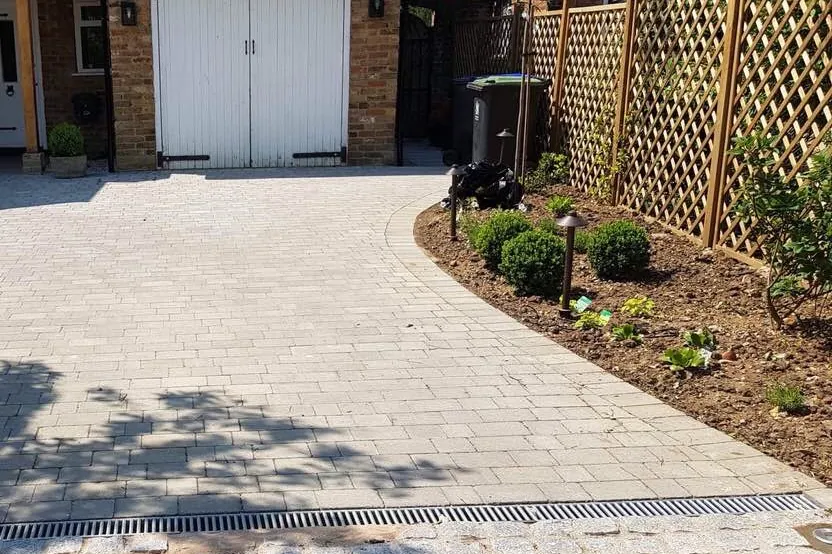 Trellis fencing along a new block paving drive, Farnham Royal, Slough, 2018