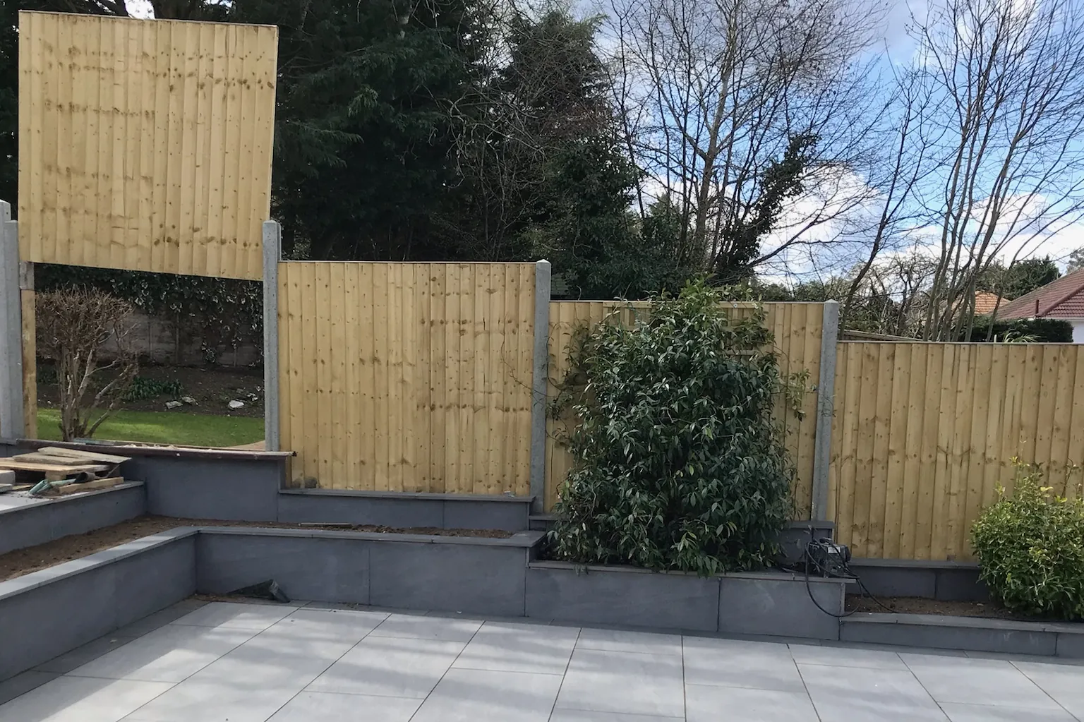 Fence panels on concrete posts above raised beds, Tilehurst, Reading, 2022