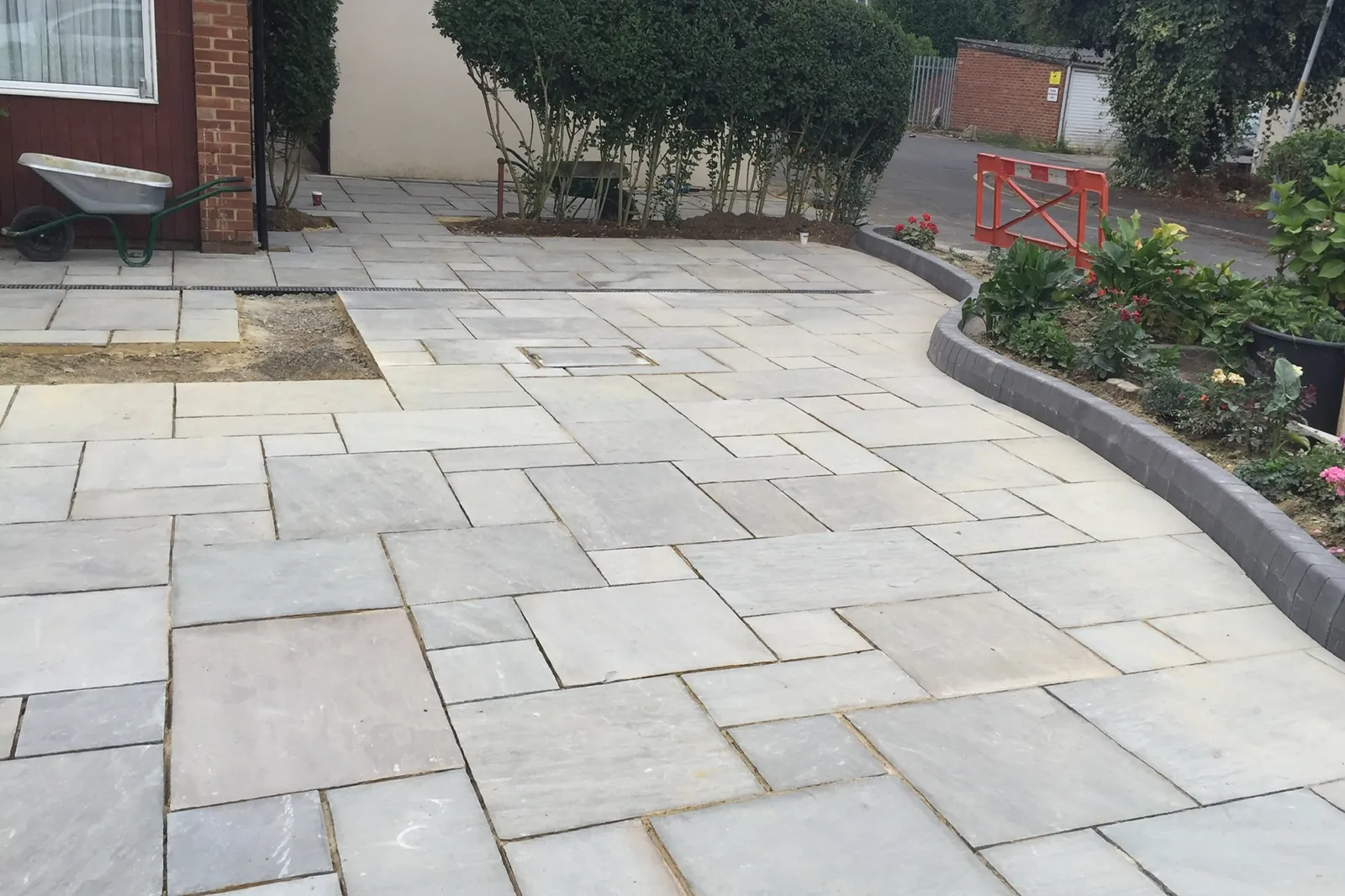 Sandstone paving with a curved planted border, Hayes, 2018
