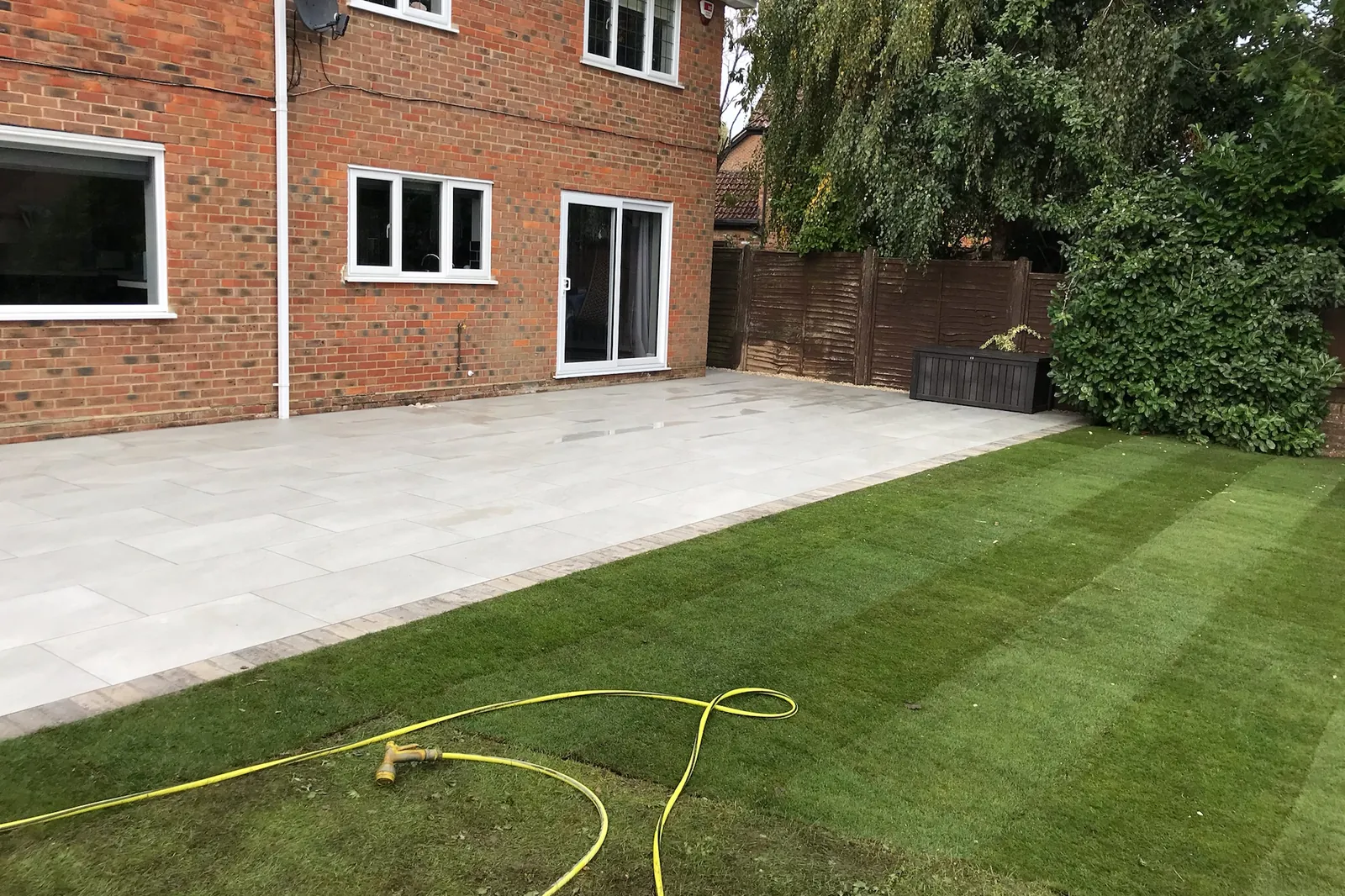 New turf laid beside a porcelain patio, Wokingham, 2020