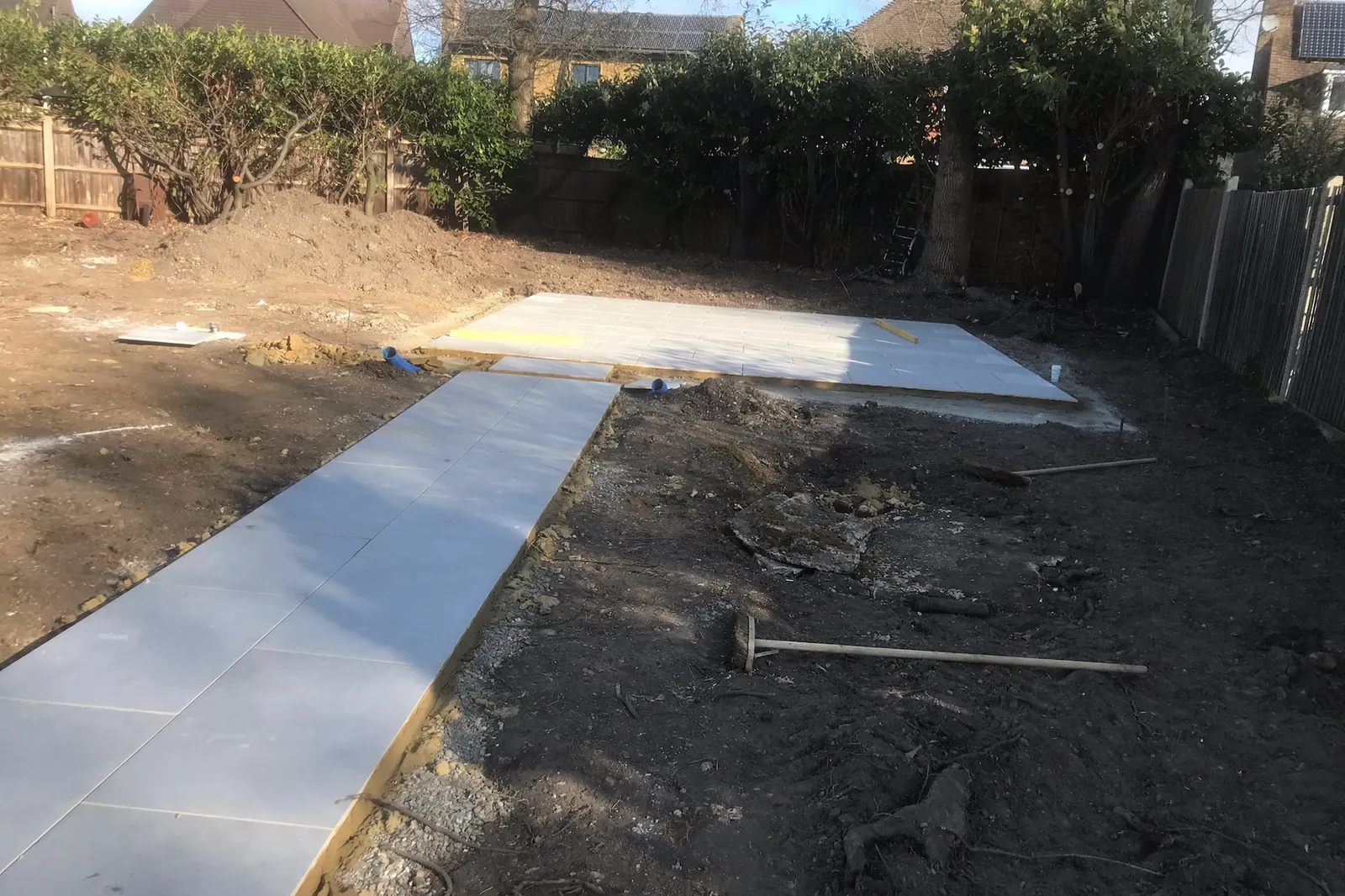 A porcelain path laid across the garden to the far patio, Farnham Royal, Slough, 2020