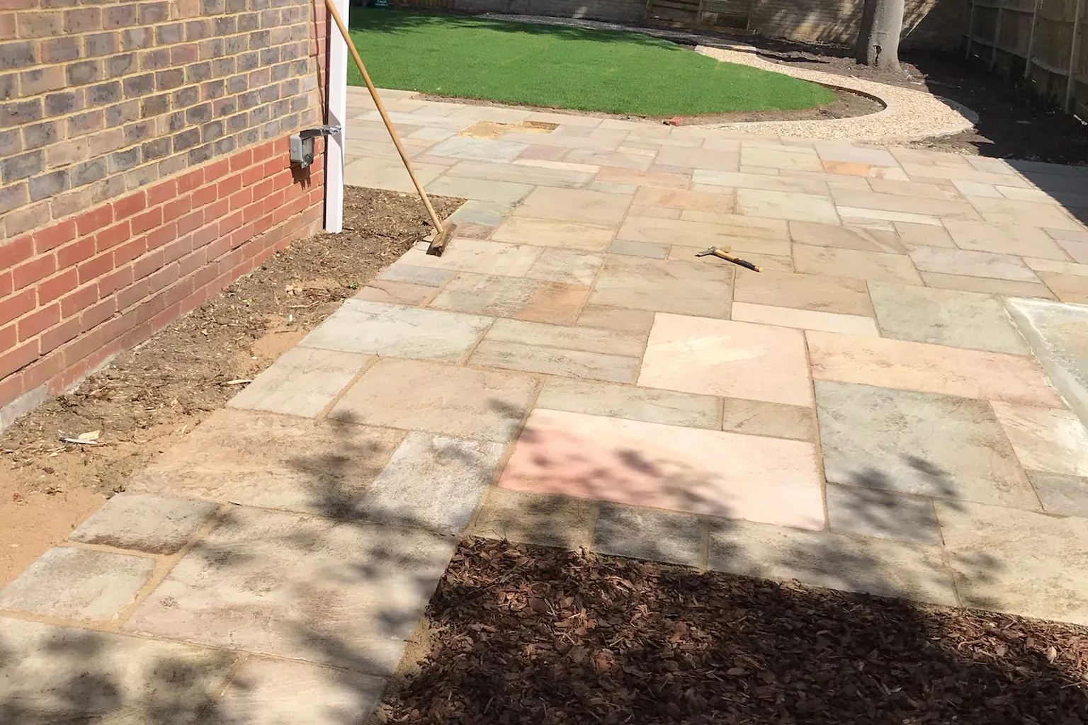 Sandstone patio laid beside the house, bark beds going in, Farnham Royal, Slough, 2020