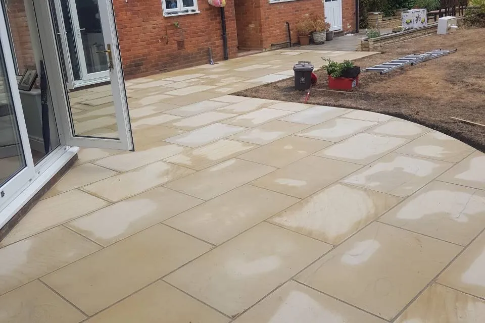Sandstone patio with a curved edge, Farnham Royal, Slough, 2019