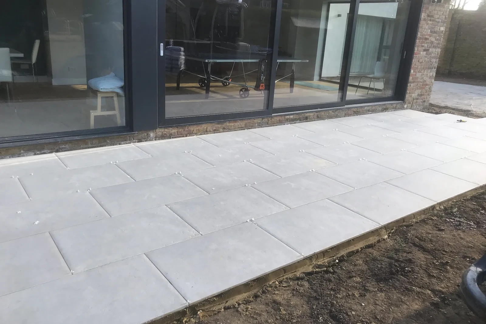 Porcelain laid along the glass doors, Farnham Royal, Slough, 2020