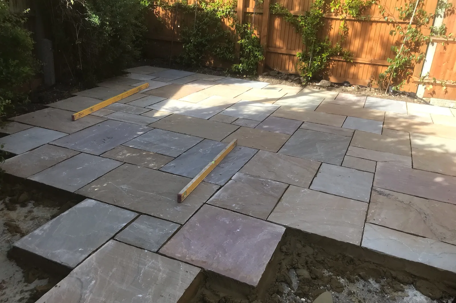 Indian sandstone being laid, the levels still out, Maidenhead, 2020