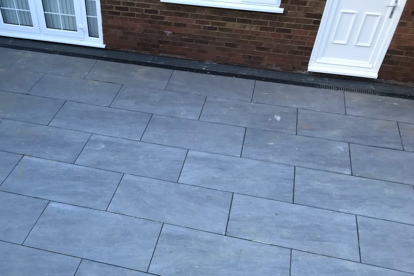 Porcelain laid across the back of the house, Tilehurst, Reading, 2022