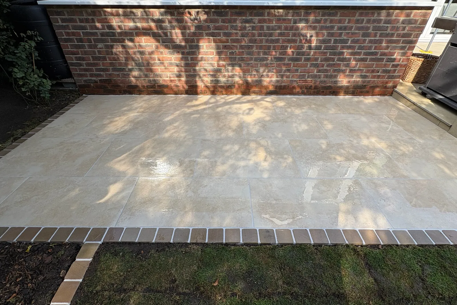 Porcelain patio with a brick edge, finished, Send, 2026