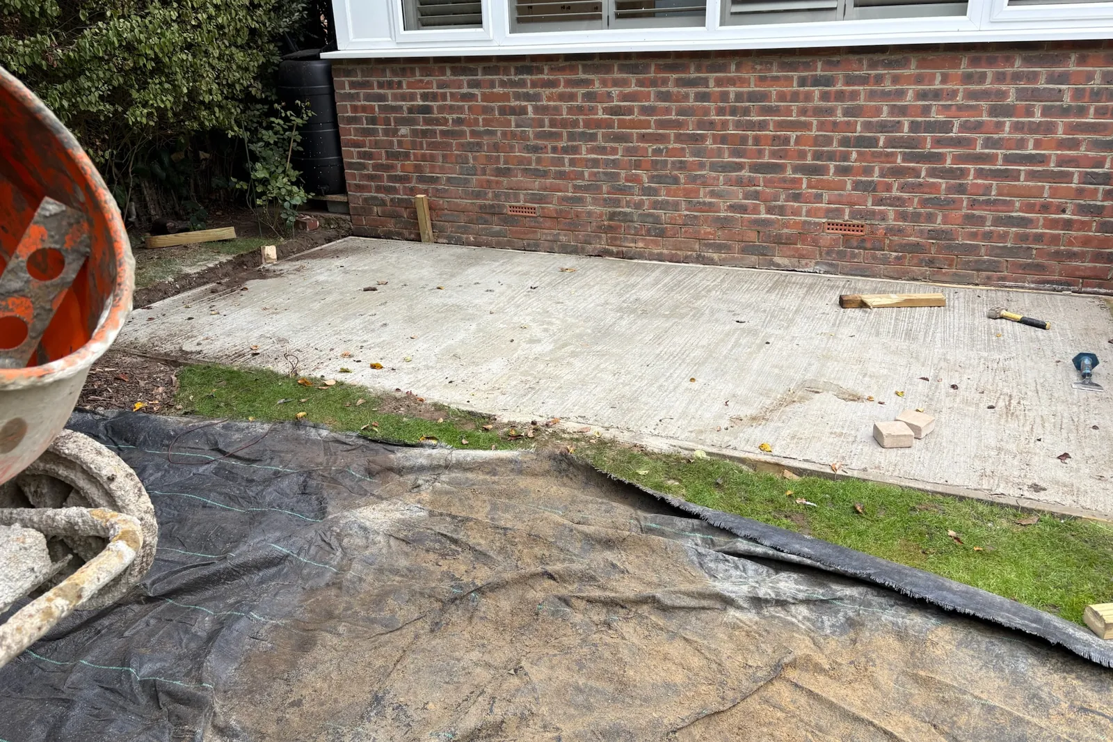 Concrete base laid along the house, Send, 2026
