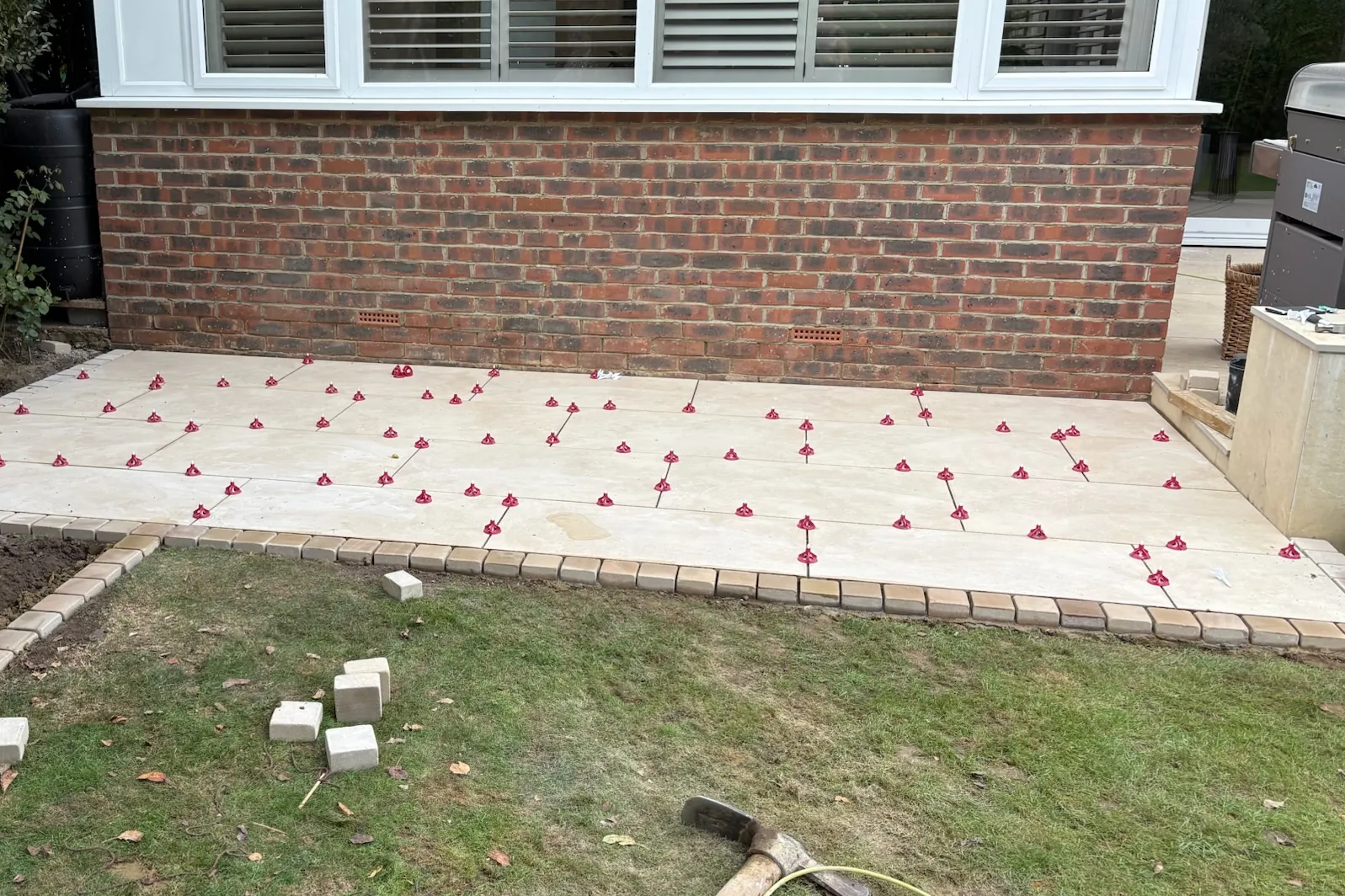 Porcelain slabs going down on levelling clips, the brick edge set, Send, 2026