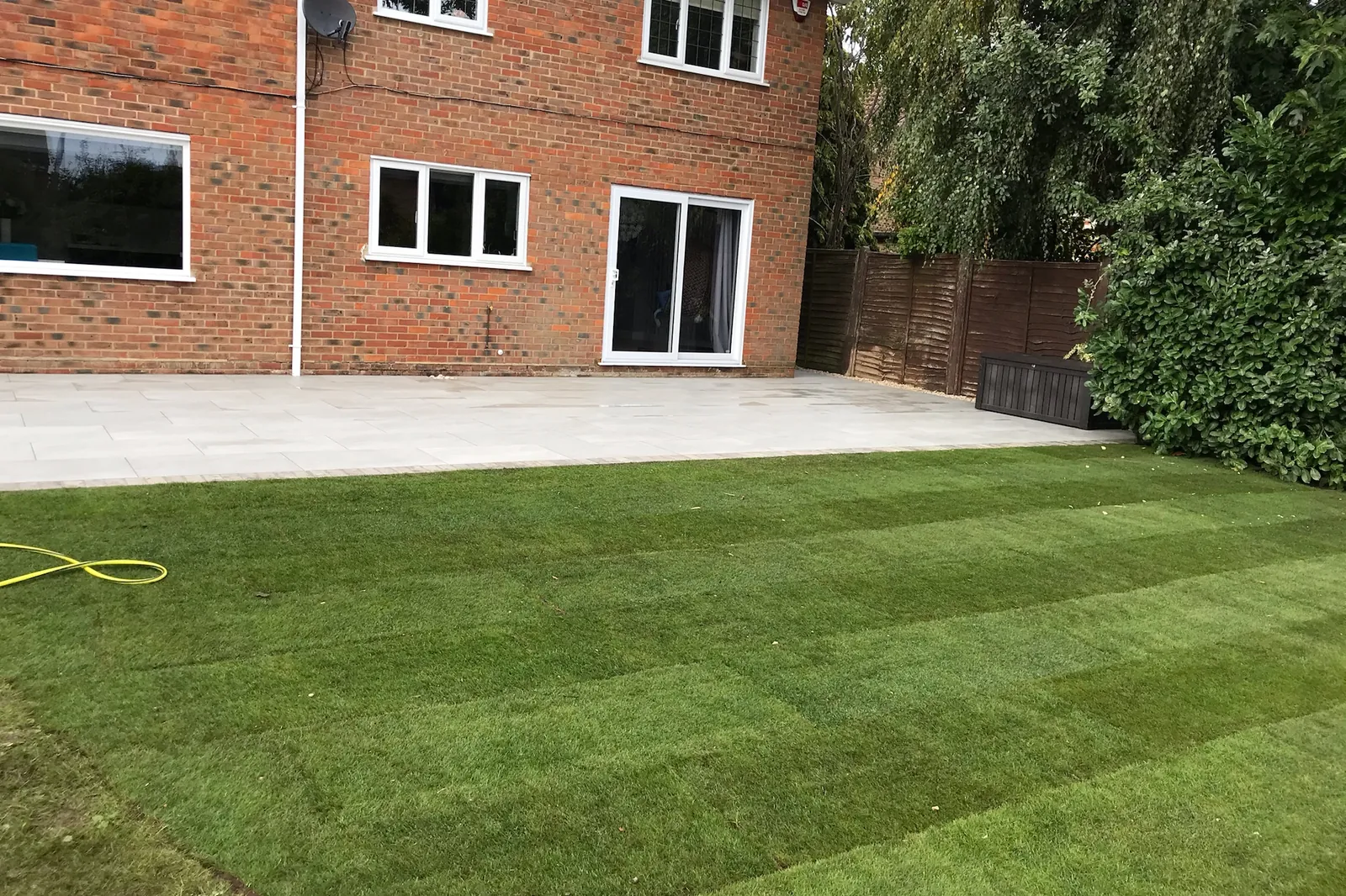 Large porcelain patio with a setts edge and new turf, Wokingham, 2020