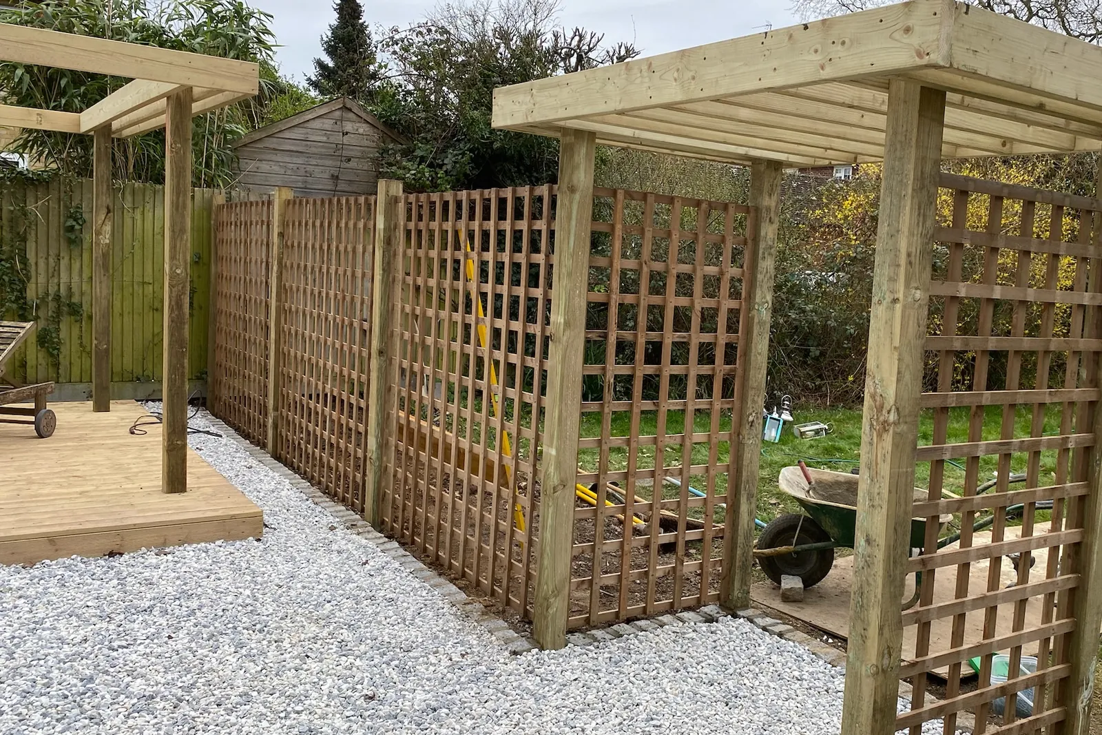 Trellis screens fixed between the pergola posts, Earley, Reading, 2024